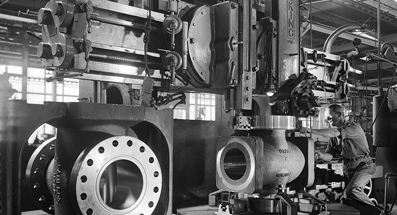 Worker_machining_hole_flange,_Cameron_Iron_Works,_Houston,_TX